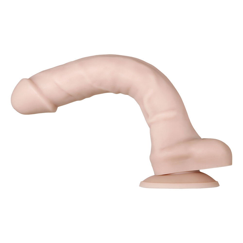 Dildo realista con glande definido y venas marcadas, visto desde una perspectiva lateral.